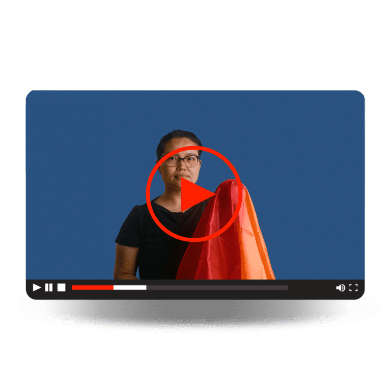 Inactivated Vaccines Video - A women holding a large, red cloth.